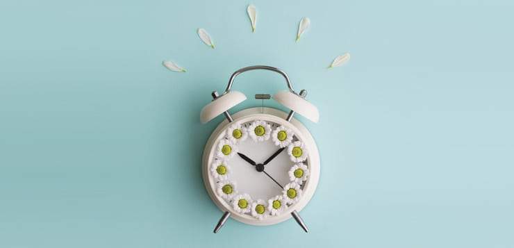 alarm clock with flower petals on top