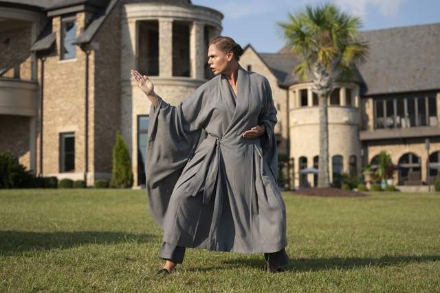 Still shot of actor Kerstin Schulze doing kung fu as Sola in The Righteous Gemstones