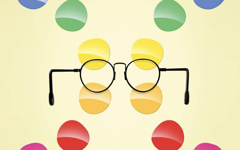 Conceptual artwork showing a pair of wire-rimmed glasses with brightly colored lenses radiating out from the frames