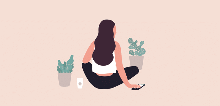 woman sitting with phone